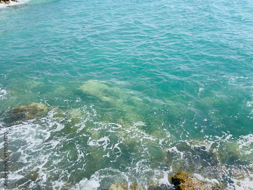 Rocky beach and crystal turquoise water of Ionian Sea in Albania. photo