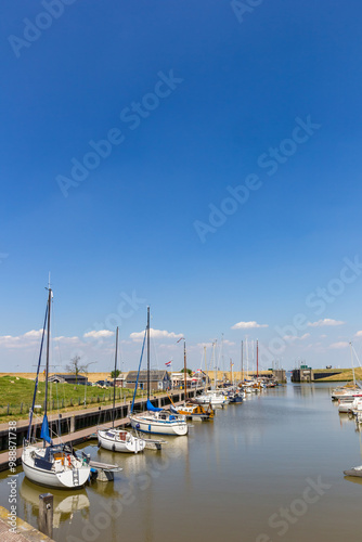 Sailing yachts in the harbor of Termunterzijl, Netherlands photo