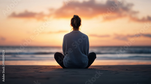 A serene moment capturing a person meditating on the beach during a beautiful sunset, reflecting peace and tranquility,  well-being