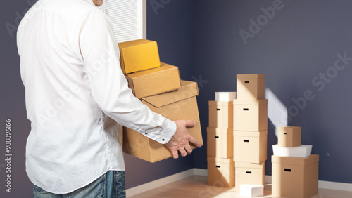 Man carries boxes during mo...