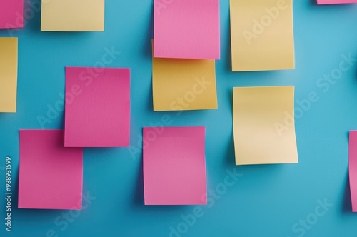 Colorful sticky notes on a blue background, ideal for brainstorming and organization.