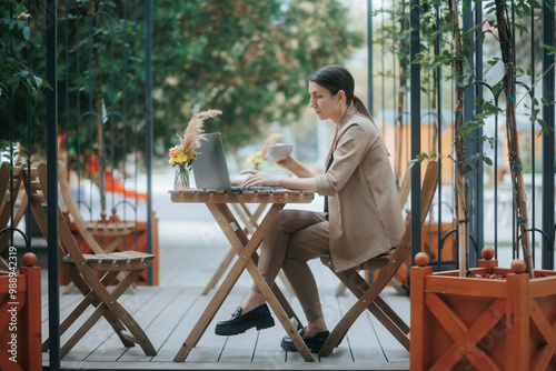 Wallpaper Mural Happy Young Woman Looking at Camera with Laptop and Breakfast Torontodigital.ca
