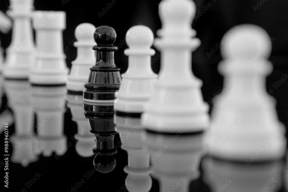 white pawn among black chess. Being different concept