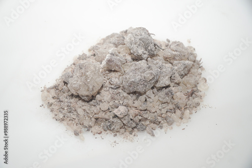 Aromatic heap of Damar Mata Kucing (Shorea Javanica) resin gum copal grade, also known as Dammar gum, isolated on a clean white background.