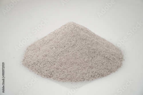 Aromatic heap of Damar Mata Kucing (Shorea Javanica) resin gum fine dust, also known as Dammar gum, isolated on a clean white background.