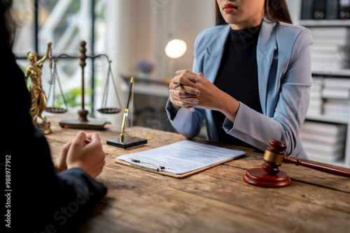 Lawyer discussing contract with client about legal case and litigation concept