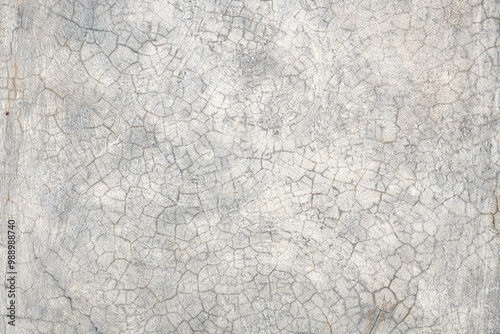 A cracked, weathered concrete surface with intricate circular patterns. The texture showcases natural aging, with visible cracks and roughness, perfect for industrial, rustic, or construction-themed d