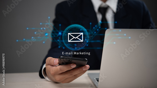 Businessman using smartphone for email marketing