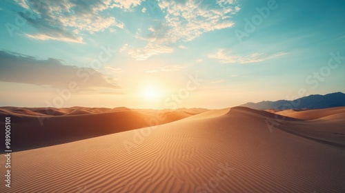 Rolling desert dunes lit by a soft morning sun, endless sky above. No people, copy space