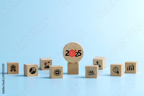 Happy New Year 2025.Business Planning Strategies 2025.wooden cubes 2025 targets and business icons, Ideas and inspirations in the New Year. budget planning and management. achieving goals. Action.