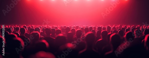 Stage lights illuminating a concert crowd with party vibe concept. Silhouetted concert crowd under vibrant red lighting, creating an energetic atmosphere photo