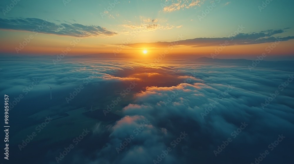 Obraz premium Remote Mountain Sunset Over Wind Turbines