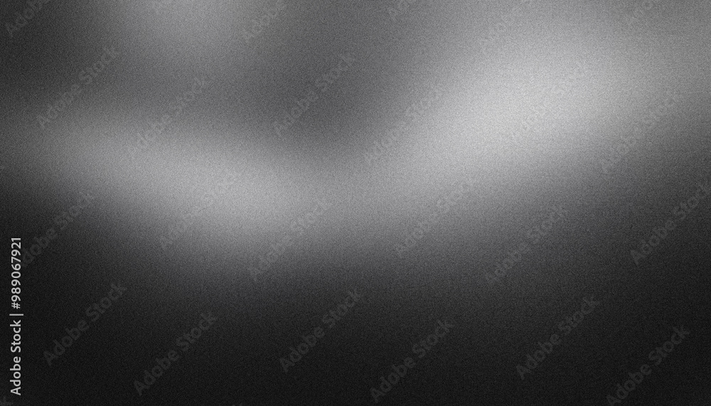 Grainy textured black and white abstract background with a smooth gradient and subtle lighting Grainy textured black and white abstract background with a smooth gradient and subtle lighting