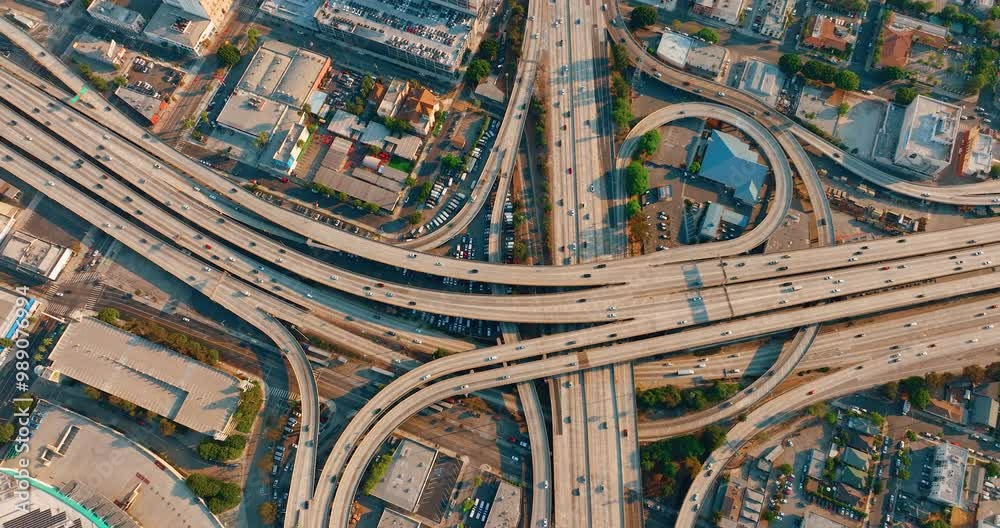 Busy traffic on multilevel roads, bridges Los Angeles California on beautiful sunny day. Aerial view overhead shot of 110 highway. Busy traffic on multilevel roads, bridges Los Angeles California on beautiful sunny day. Aerial view overhead shot of 110 highway.