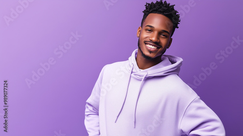 Casual Vibes: Handsome Young Man Posing in Lavender Against Purple