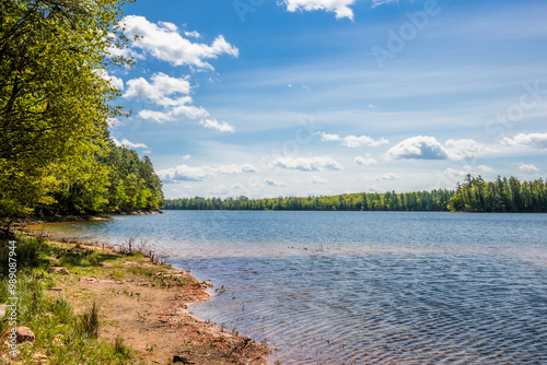 Overlooking the larger section of Lost Canoe Lake near Boulder Junction, Wisconsin with two rrental rowboats on shore. photo