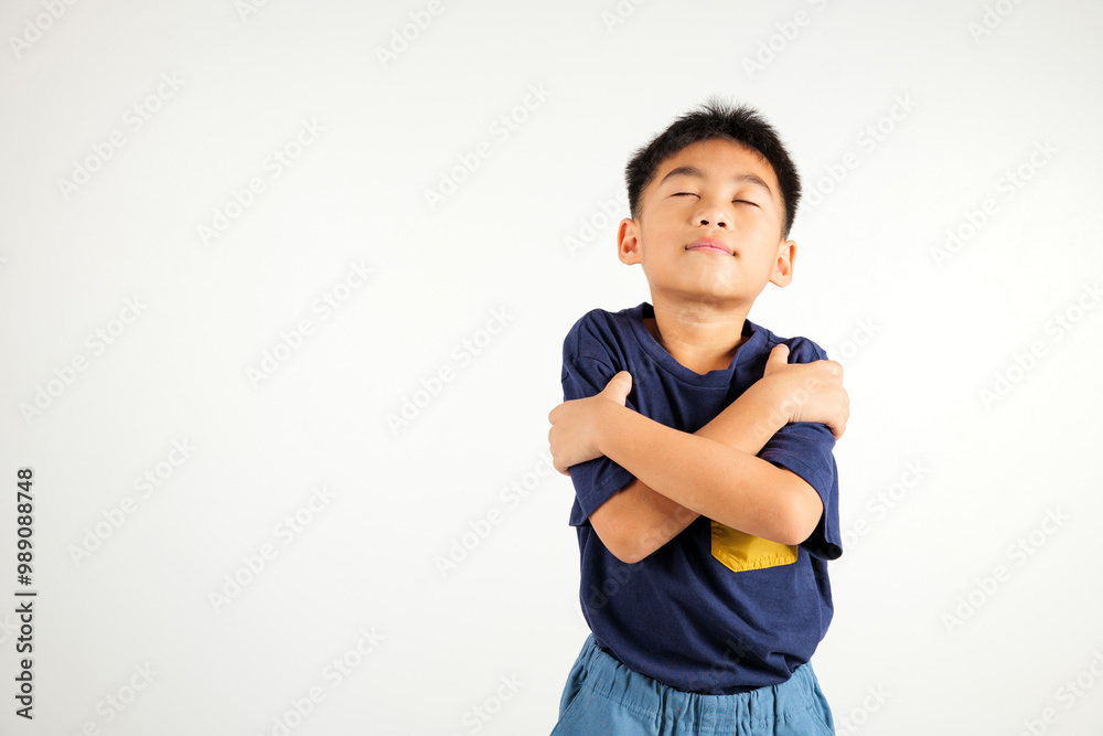Happy young child smiling Asian boy hugging herself remember a moment studio short isolated on white background, Self care and self esteem concept, Lifestyle primary kid love yourself carefree Happy young child smiling Asian boy hugging herself remember a moment studio short isolated on white background, Self care and self esteem concept, Lifestyle primary kid love yourself carefree