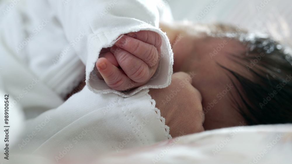 Newborn baby sleeping peacefully on a bed, close-up of face and hand resting gently, highlighting the calm and serenity of a baby's restful slumber in a soft, warm environment Newborn baby sleeping peacefully on a bed, close-up of face and hand resting gently, highlighting the calm and serenity of a baby's restful slumber in a soft, warm environment