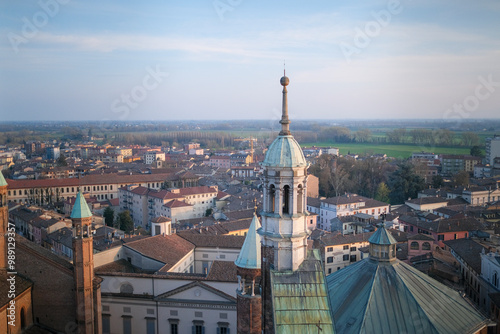 Cremona panorama of the cathedral bell tower from the Torrazzo tower at sunset. High quality photo. High quality photo photo