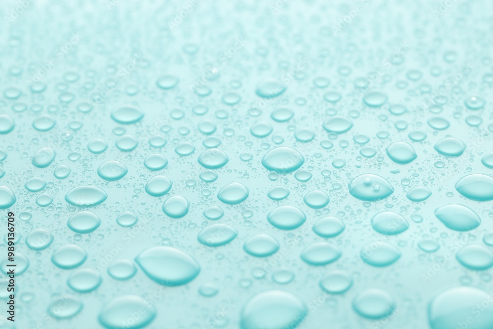 Water drops on turquoise background, closeup view Water drops on turquoise background, closeup view
