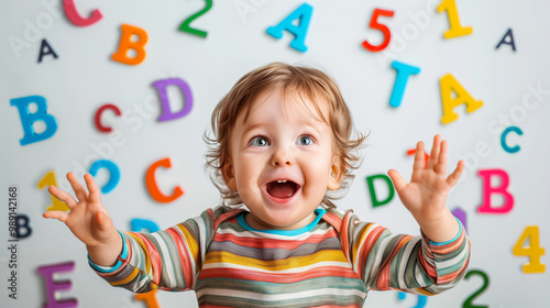 1 2 year old happy child on the background of letters and numbers, the concept of early education for preschool children