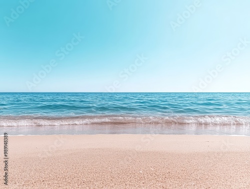 Tranquil Summer Beach with Detailed Sand and Azure Ocean Horizon photo