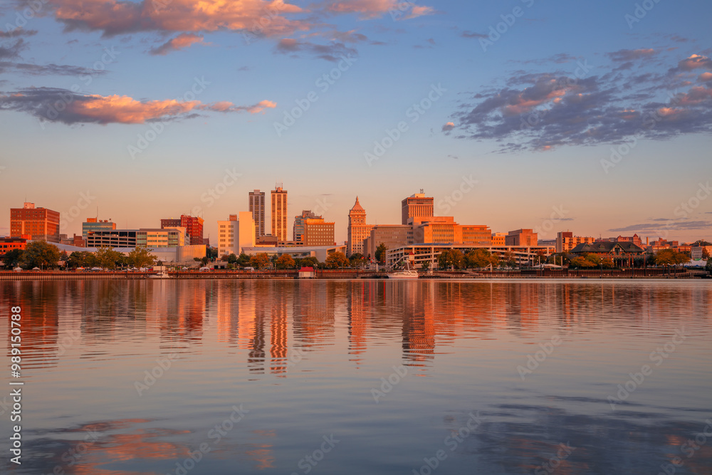 Peoria, Illinois, USA. Cityscape image of Peoria skyline, Illinois, USA with reflection of city lights in the Illinois River at autumn sunrise.