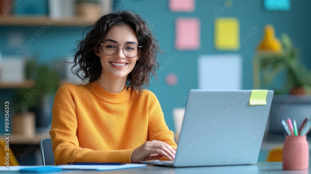Smiling Woman Working on Laptop in Office Smiling Woman Working on Laptop in Office