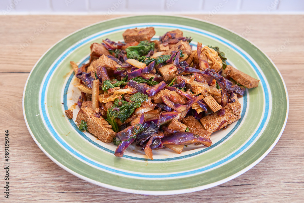 Delicious Stir-Fried Tofu with Colorful Vegetables on a Plate Delicious Stir-Fried Tofu with Colorful Vegetables on a Plate