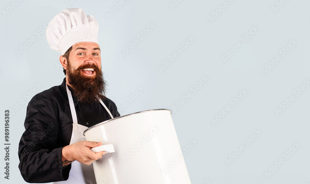 Happy bearded man in chef uniform with saucepan. Cooking, culinary and food preparation - smiling male chef with pan saucepan. Kitchen utensils and professional cookery. Copy space for advertising. Happy bearded man in chef uniform with saucepan. Cooking, culinary and food preparation - smiling male chef with pan saucepan. Kitchen utensils and professional cookery. Copy space for advertising.
