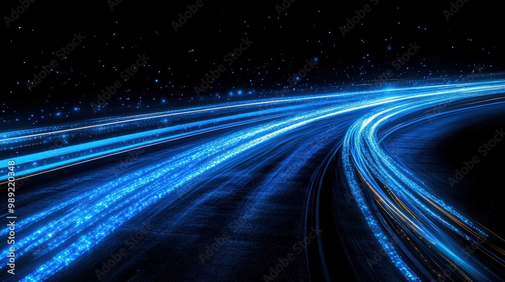 Abstract blue light streaks on a black background, resembling a futuristic road or track. Abstract blue light streaks on a black background, resembling a futuristic road or track.
