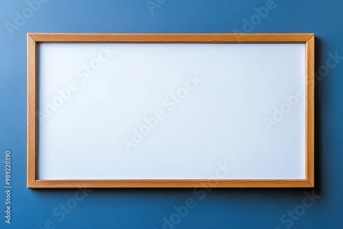 blank wooden frame on blue wall background