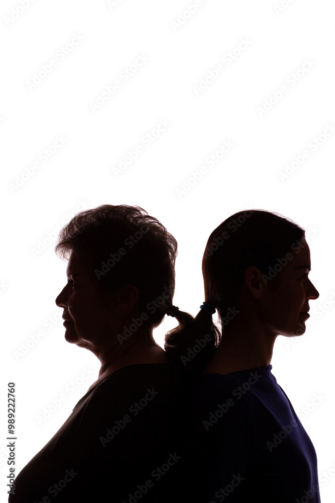 Silhouette elderly woman opposite young woman, mother and daughter - isolate Silhouette elderly woman opposite young woman, mother and daughter - isolate