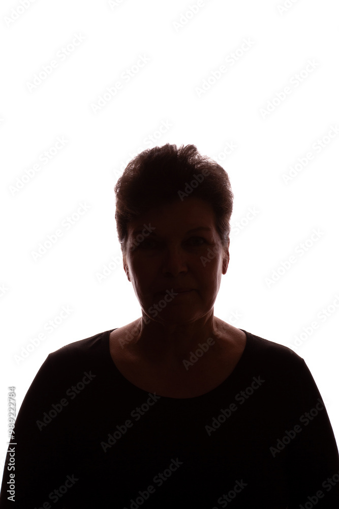 Dark silhouette of an elderly woman, pensioner, curly hair - isolate Dark silhouette of an elderly woman, pensioner, curly hair - isolate