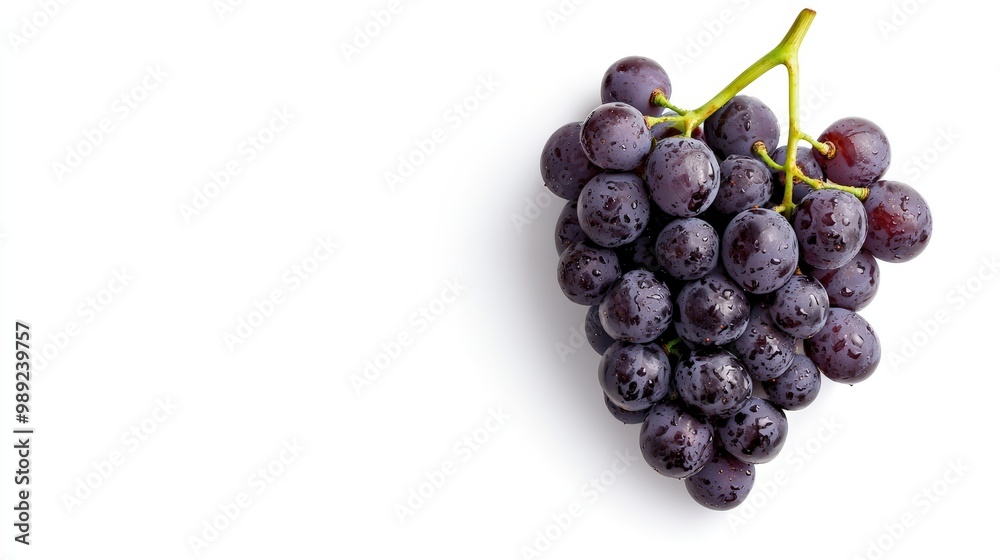 Fresh bunch of dark purple grapes isolated on a white background, perfect for healthy lifestyle and food-related themes. Fresh bunch of dark purple grapes isolated on a white background, perfect for healthy lifestyle and food-related themes.