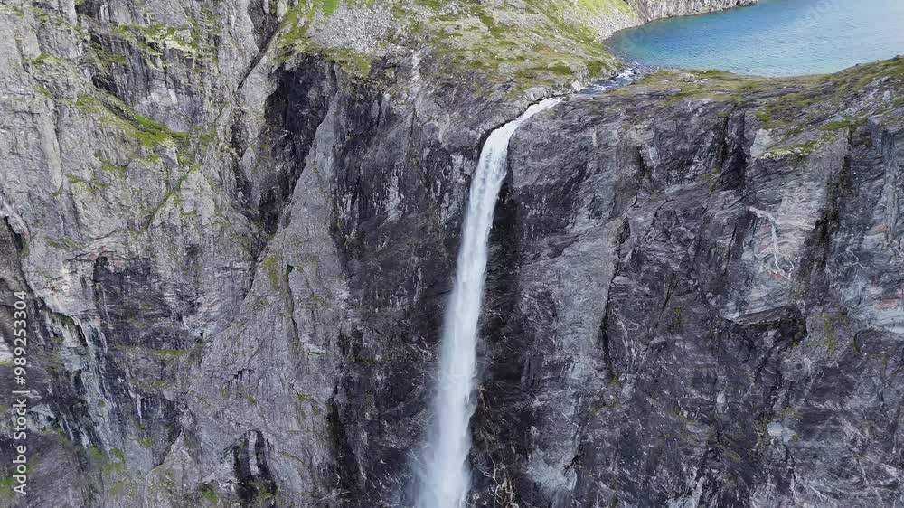 Epic waterfall in clouds zoom out drone shot, double waterfall of Mardalsfossen in Norway in 4K. Epic waterfall in clouds zoom out drone shot, double waterfall of Mardalsfossen in Norway in 4K.