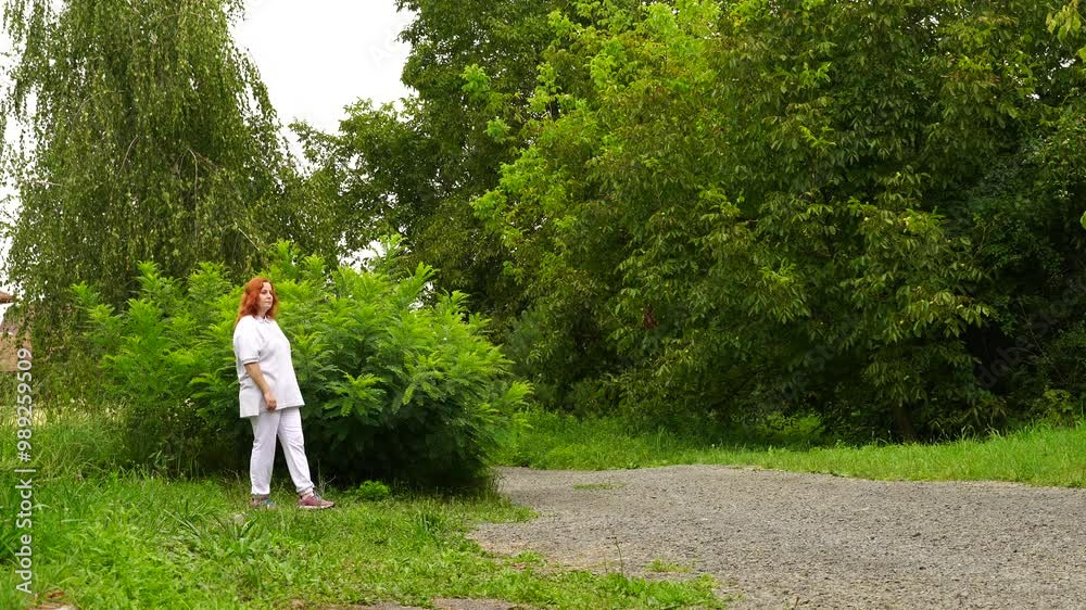 Senior woman walks relaxing outdoor on nature Senior woman walks relaxing outdoor on nature