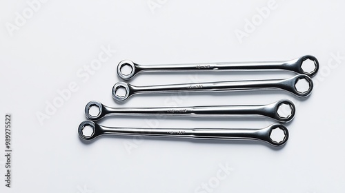 Futuristic Allen key set smart selfadjusting tips adapt various bolt sizes fully visible neatly arranged white plain background emphasizing their versatility innovative design future mechanical work photo