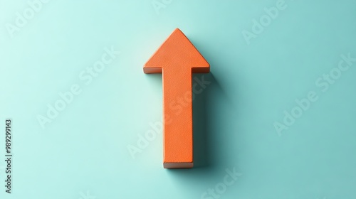 A thin orange arrow pointing up on a plain mint background