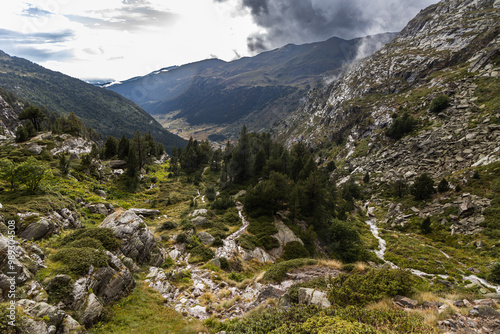 Vall d'incles, valley in the mountains after the rain, stormy clouds