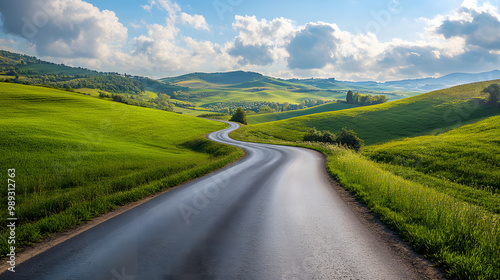 A scenic drive through a countryside road rolling hills and farmland on either side.