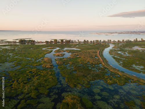 Aerial panoramic sunset sunrise scene at swamps and wetlands of Big Creek National Wildlife Area near Long Point Provincial Park, Lake Erie shore.