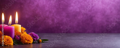 Burning candles and cempasuchil or marigold flowers on a purple background for the Mexican Day of the Dead ritual. Dia De Los Muertos Celebration decor for banner, poster, flyer with copy space. photo