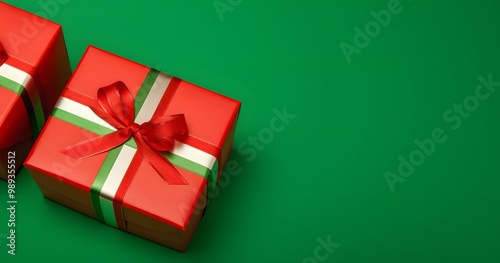 Red Gift Boxes With Green Ribbon On Green Background