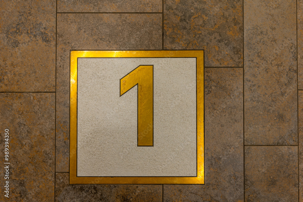 gold and white square with the number 1 on it gold and white square with the number 1 on it