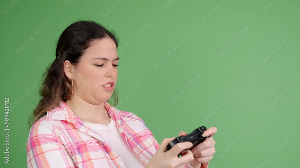 Woman playing video games making different faces on green screen Woman playing video games making different faces on green screen