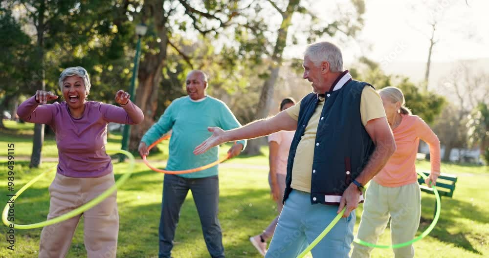 Senior people, exercise and nature with hoop for class, fun workout or elderly care in fitness. Happy or mature group talking with toy for movement, balance or funny activity together at outdoor park Senior people, exercise and nature with hoop for class, fun workout or elderly care in fitness. Happy or mature group talking with toy for movement, balance or funny activity together at outdoor park