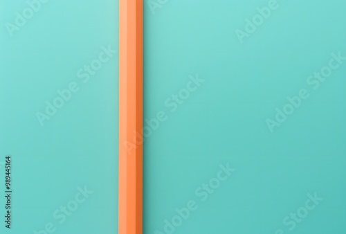 Minimalist Abstract Background with Orange Pencil on Turquoise Paper