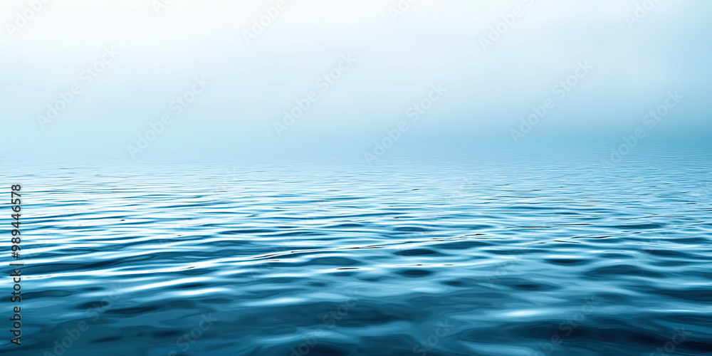 The image is of a calm body of water with a blue color The image is of a calm body of water with a blue color