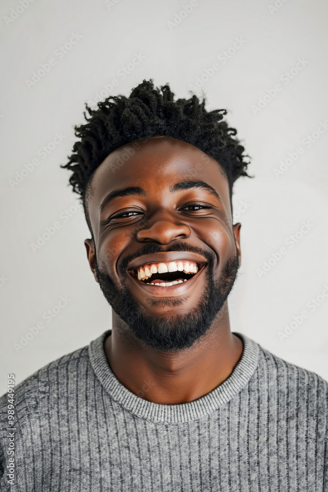 A man with a beard smiles at the camera A man with a beard smiles at the camera